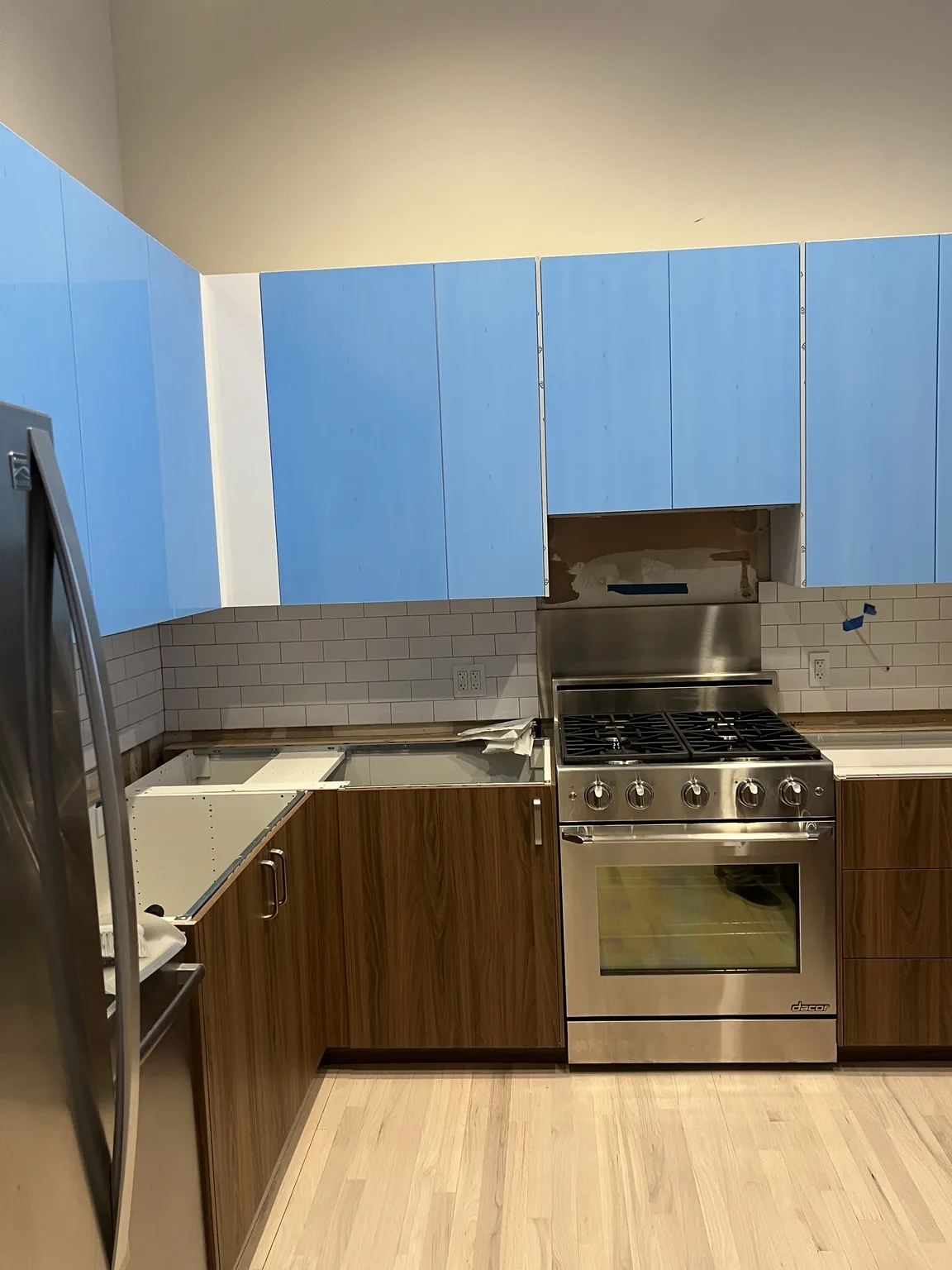 Walnut Cabinets with Blue Countertop — photo 1